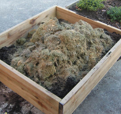 building the soil with dry grass clippings in the fall